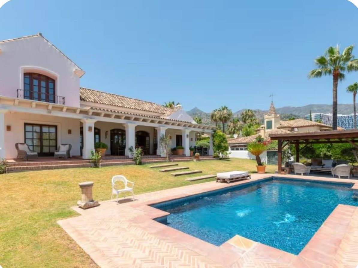 The Escape villa with its private pool, lawn and covered terrace in the Marbella hills
